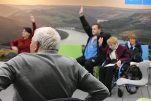 Older people in a chair aerobics session