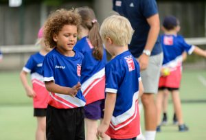 Two children playing football