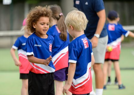 Two children playing football