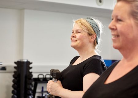 two women with dumbells